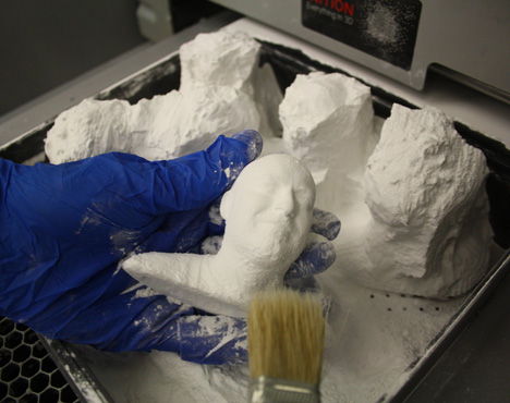 Cleaning off excess powder-SLS